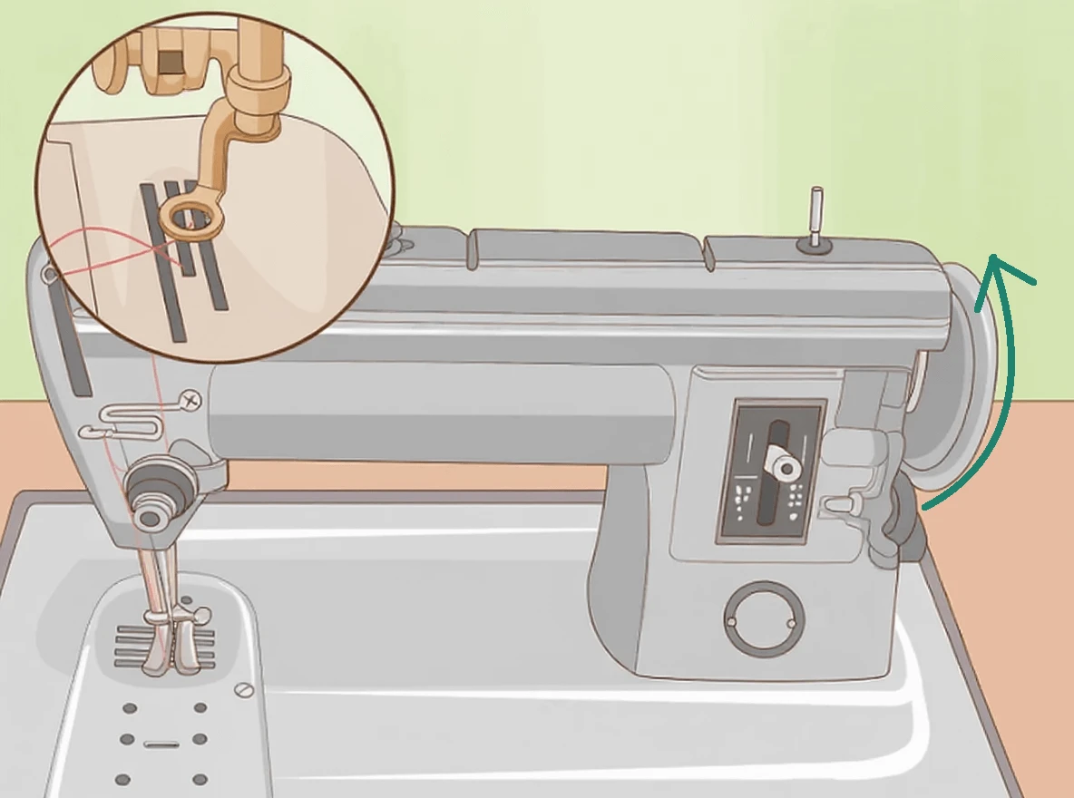 Turn the hand crank clockwise a few times to catch the thread