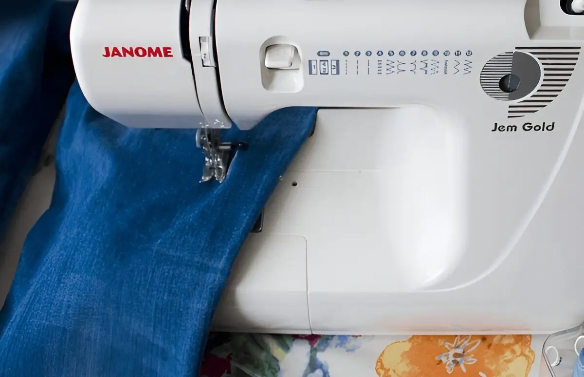 Close-up of a perfect, straight stitch line on denim fabric made by a Janome sewing machine.