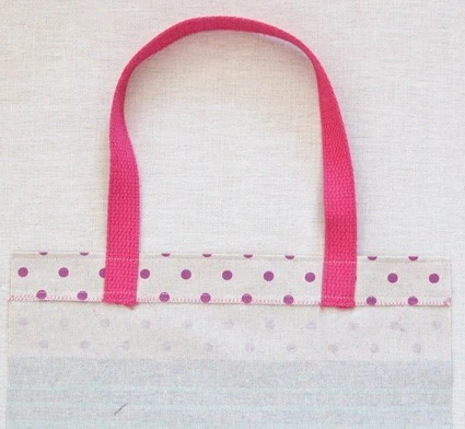 Zig-zag stitch securing tote handle with double-folded hem stitched in place